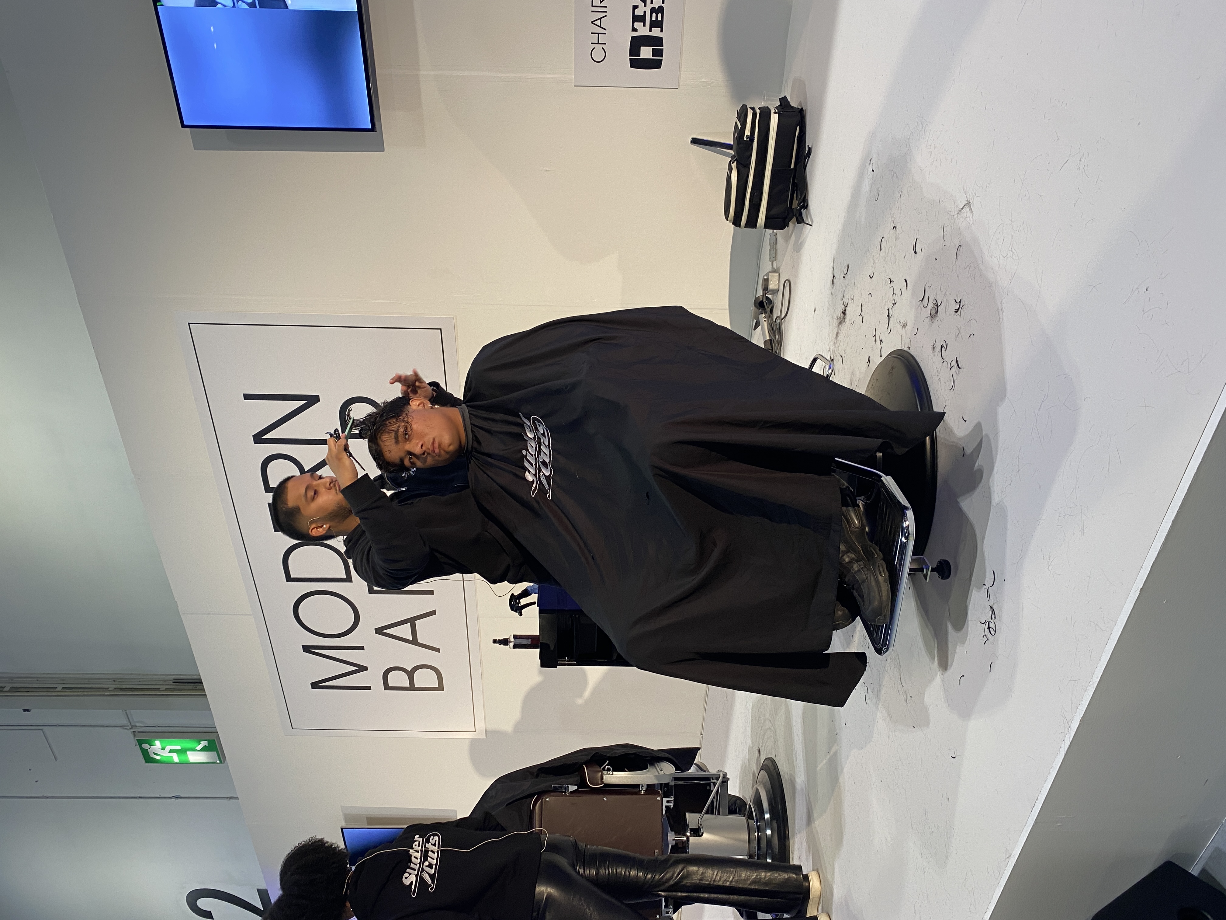 Kishan Weerasuriya barbering in his Shoreditch studio